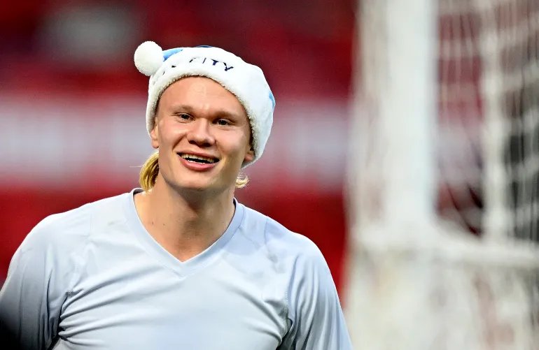 NOTTINGHAM, ENGLAND - DECEMBER 27: Erling Haaland of Manchester City celebrates whilst wearing a Man City Father Christmas hat after the Premier League match between Nottingham Forest and Manchester City at City Ground on December 27, 2025 in Nottingham, England. (Photo by Clive Mason/Getty Images)
